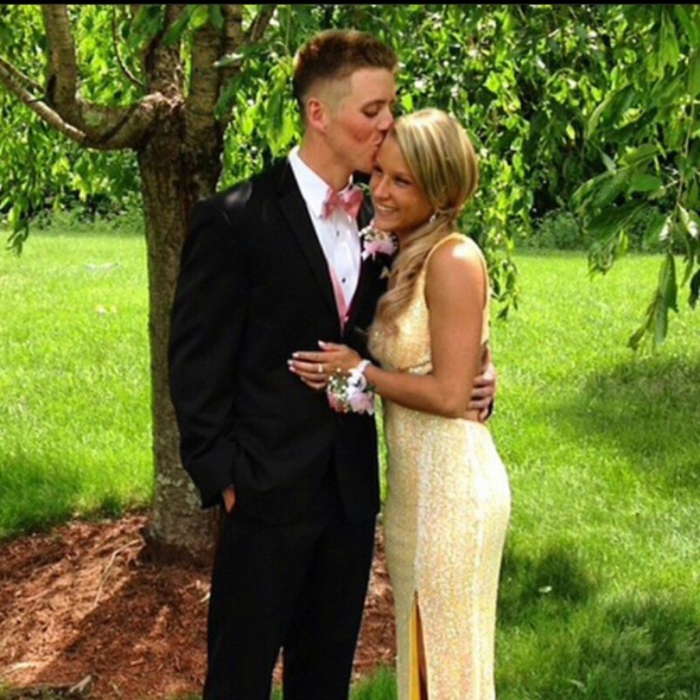 A floor length, sequence, pink& yellow prom dress
